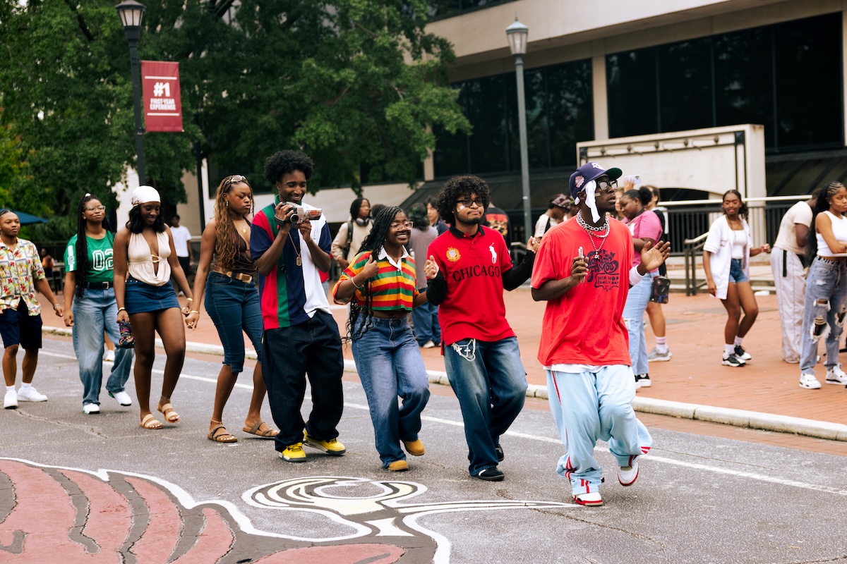 Students line dancing on Greene Street