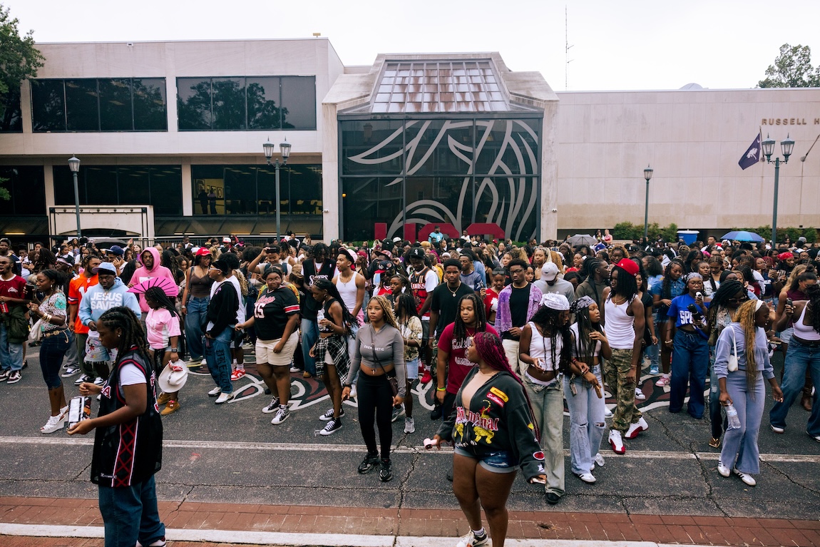 A large crowd of students dancing on Greene Street 