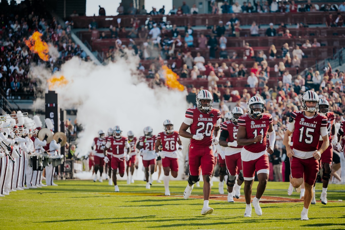Football players running on the field