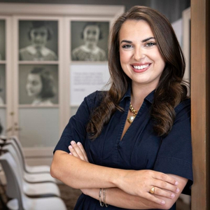 Sam Livoti poses in the doorway of the Anne Frank Center's museum
