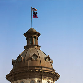 Flags on the dome of the Statehouse