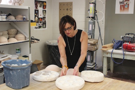 Virginia Scotchie working with molds