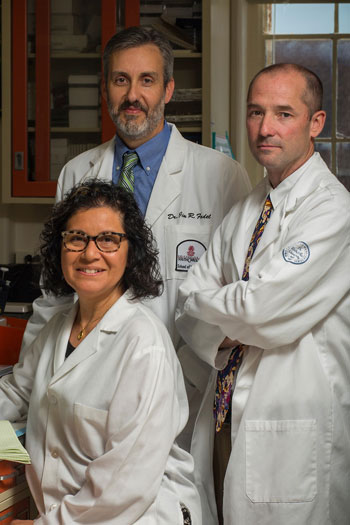 Claudia Grillo and her research colleagues, Jim Fadel, left, and Larry Reagan