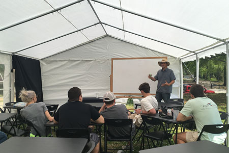 Students learn in an outdoor classroom near the Green Quad