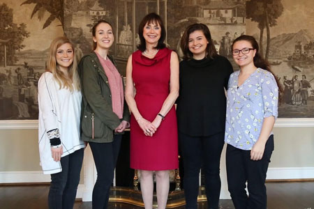 journalism students with First Lady Patricia Moore-Pastides