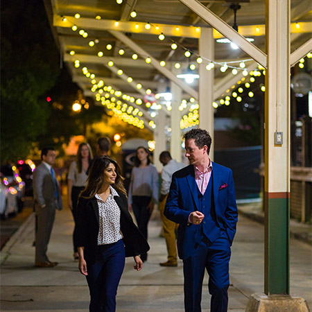 people walking in the Vista at night