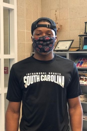 James Collins, a campus rec student employee, wearing a uofsc face covering and an intramural sports ts hirt