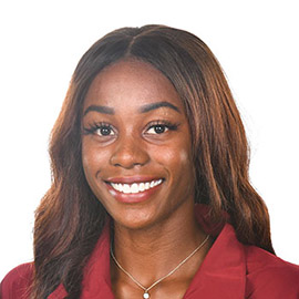 Aliyah Abrams smiles at the camera