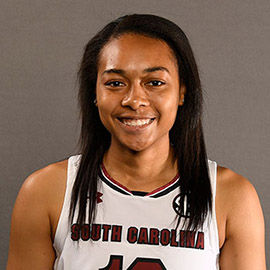 Allisha Gray, wearing her Gamecock uniform, smiles at the camera