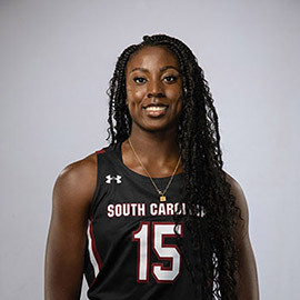 Laeticia Amihere, wearing her Gamecocks uniform, smiles at the camera