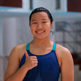 Tinky Ho gives a thumbs up at the camera