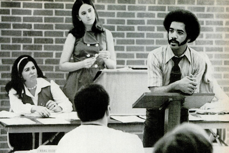 archival image of harry walker in a classroom