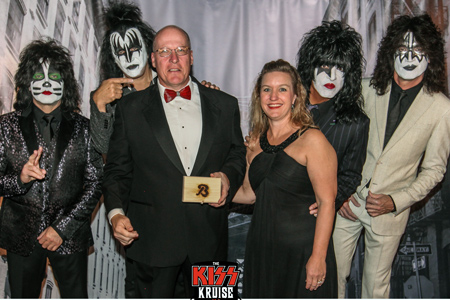 John Downs and his wife, Margaret Norris Downs, with members of the band KISS in full makeup.