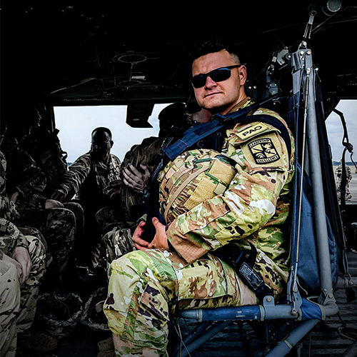Jack Sadle wearing a UofSC Army ROTC uniform while sitting in a UH-60 Blackhawk helicopter.