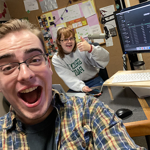 Ben Spells takes a selfie with a friend in the WUSC radio station sound booth.