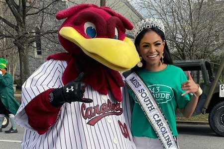 Miss South Carolina USA, Meera Bhonslé poses with Cocky mascot