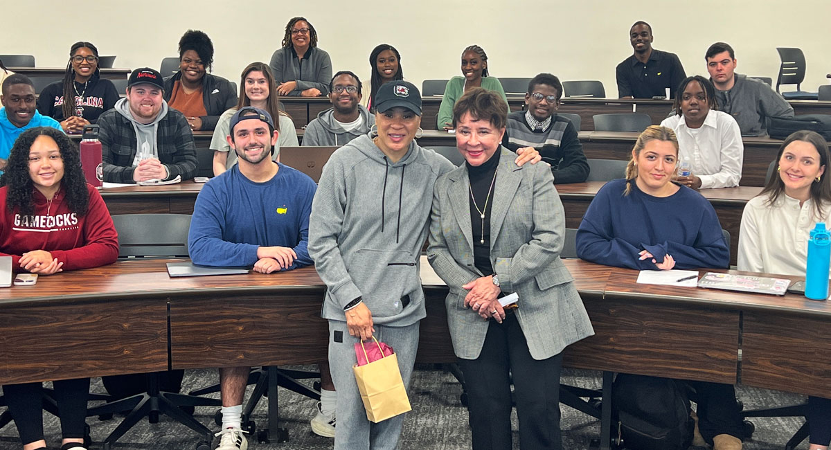 Sheila Johnson poses with Dawn Staley during an HRSM class.