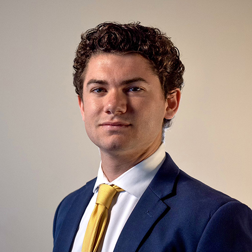 headshot of a man in a suit