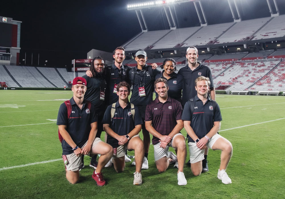Justin King and his team on the field at Williams-Brice stadium.