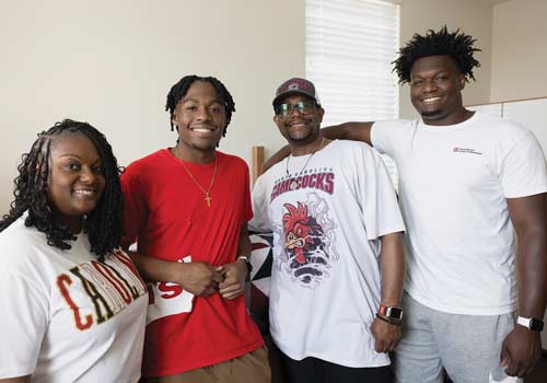 Jayden Pyles with his parents and brother on move-in day.