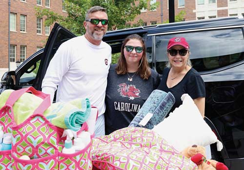 Addy Felkel at Campus Village with her parents on move-in day.