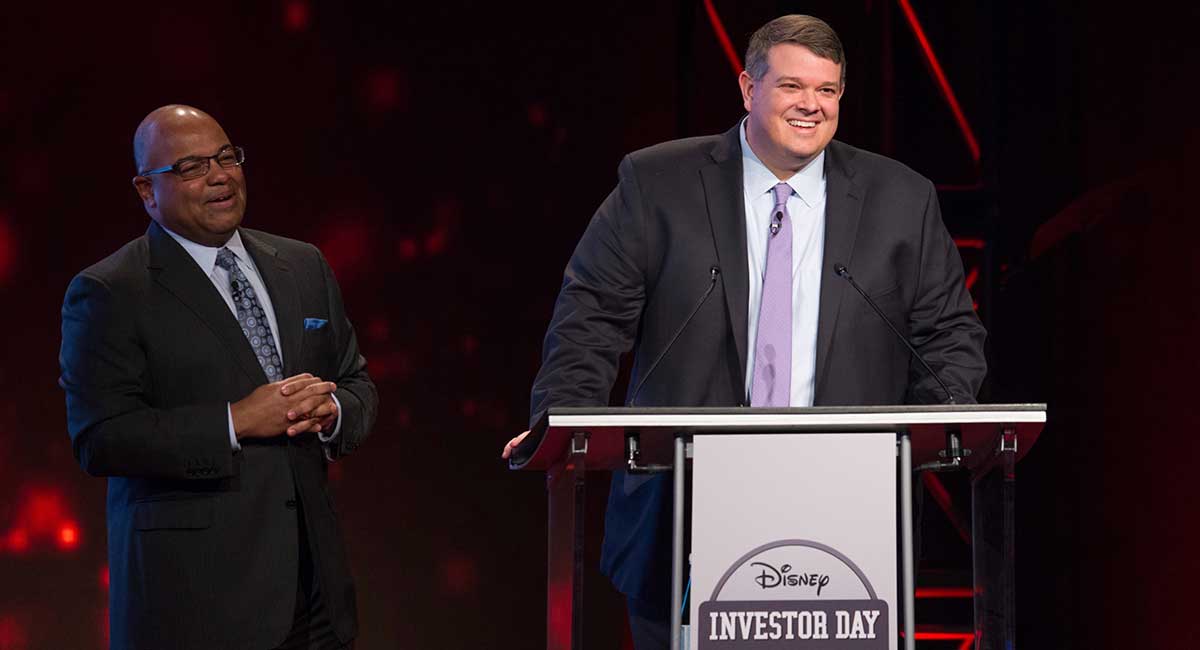 USC alumnus Aaron LaBerge stands at podium during Disney Investor Day