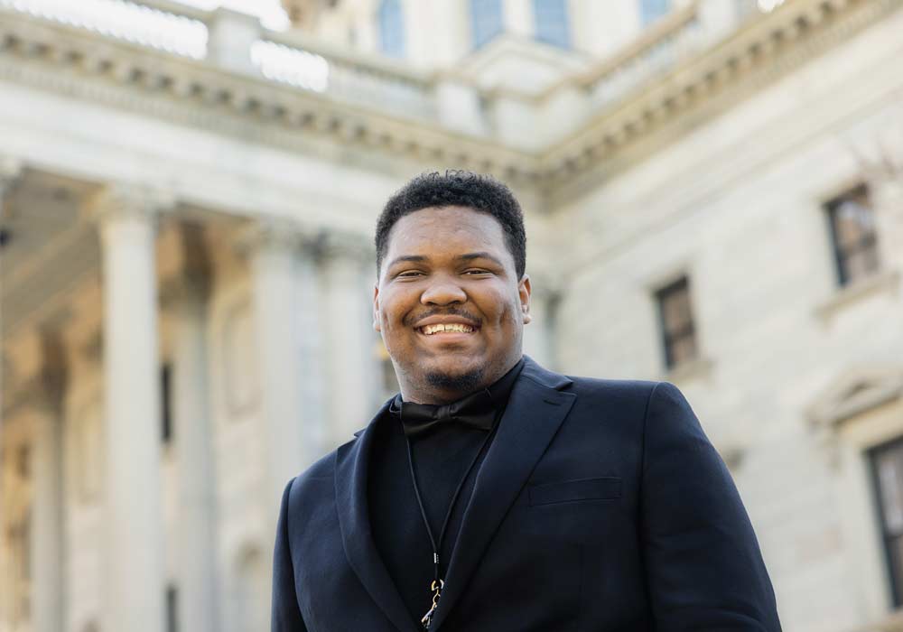 Myron Harris stands in front of the South Carolina statehouse.