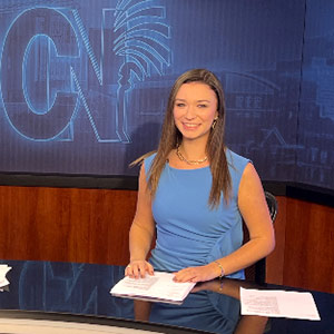 Haley Bowic on the set of Carolina News in the journalism school.