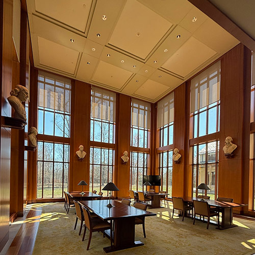 Library with floor-to-ceiling windows and conference table