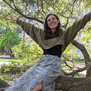 Sarai Deese with arms outstretched in Horseshoe trees