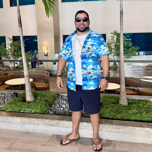 man stands in front of a building 