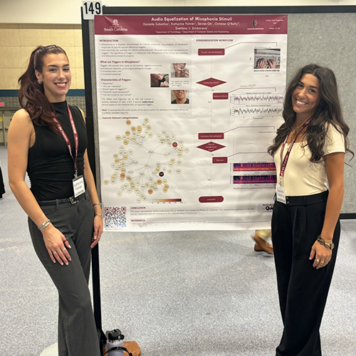 Katherine Palmer stands next to her poster titled "Audio Equalization of Misophonia Stimuli." Remaining poster text is not distinguishable.