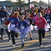 girls running in a Girls on the Run race