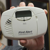 Amber Williams with carbon monoxide detector